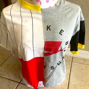 NIKE cropped tee, fits oversized like a small.